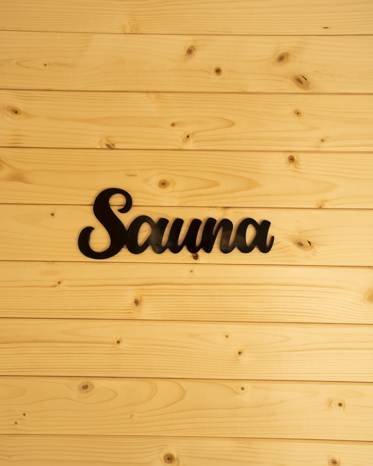 The wood-fired sauna, looking straight out over the fjord.